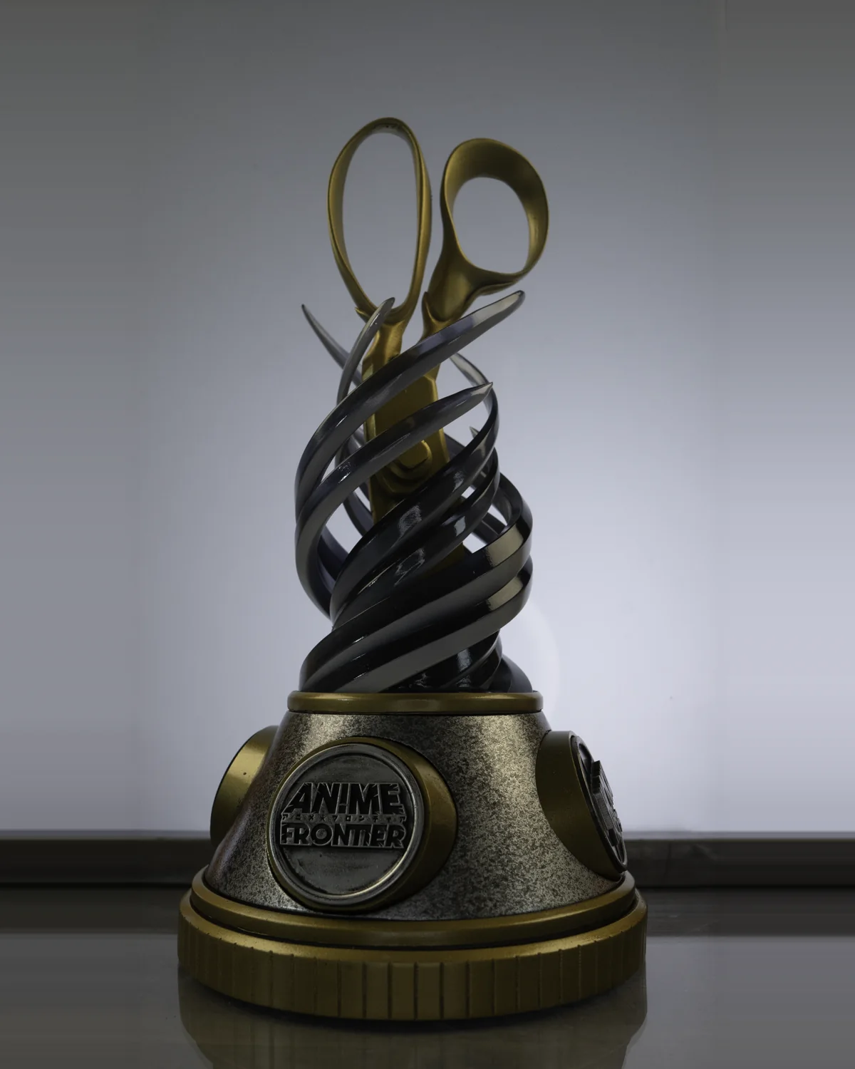 The Anime Frontier Best in Show trophy by Hoku Props on a light backdrop