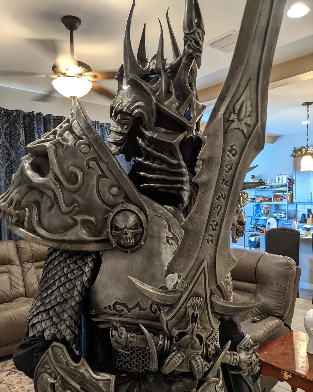The finished Lich King armor by Hoku Props worn with helmet and runeblade, skull pauldron and chest plate in weathered steel