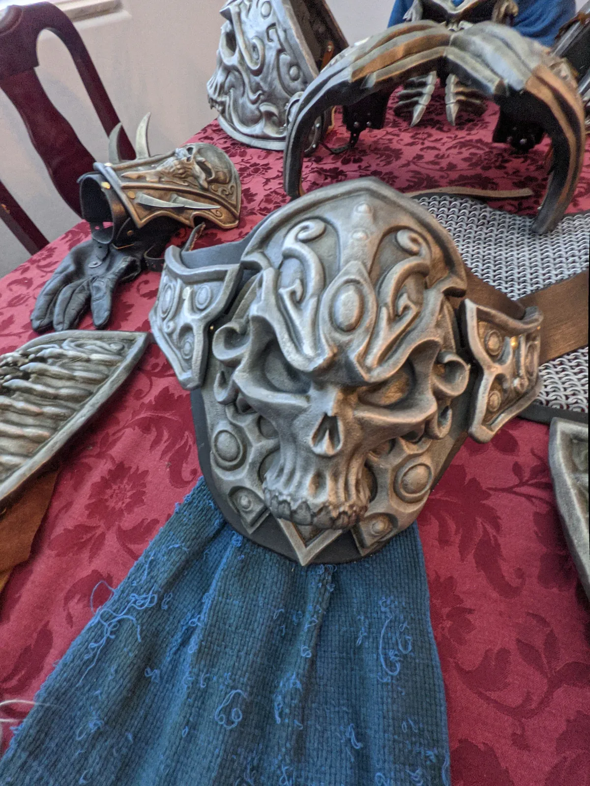 Lich King chest plate by Hoku Props with a sculpted skull boss over a blue tabard