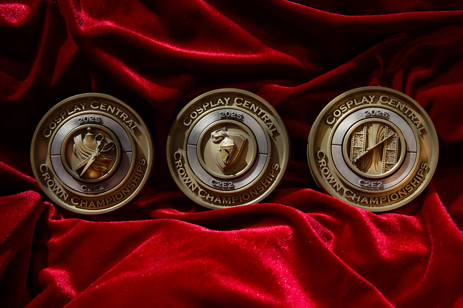 Three 2025 C2E2 craft category medals by Hoku Props with sculpted tool emblems, on red velvet