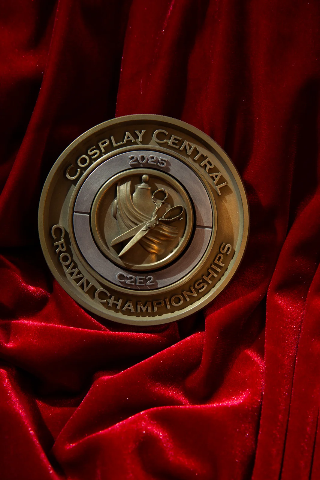 A 2025 C2E2 Crown Championships craft category medal by Hoku Props with a sculpted tool emblem