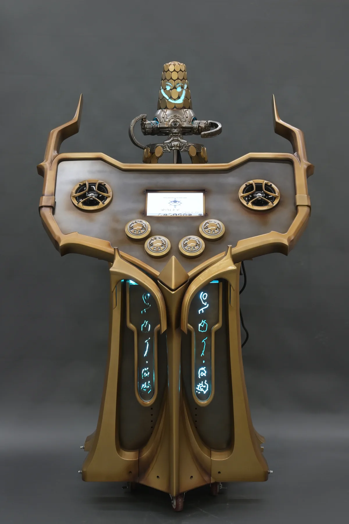 Front view of the Secrets of the Sanctum cabinet with Loid lit above the control panel and glyph panels glowing