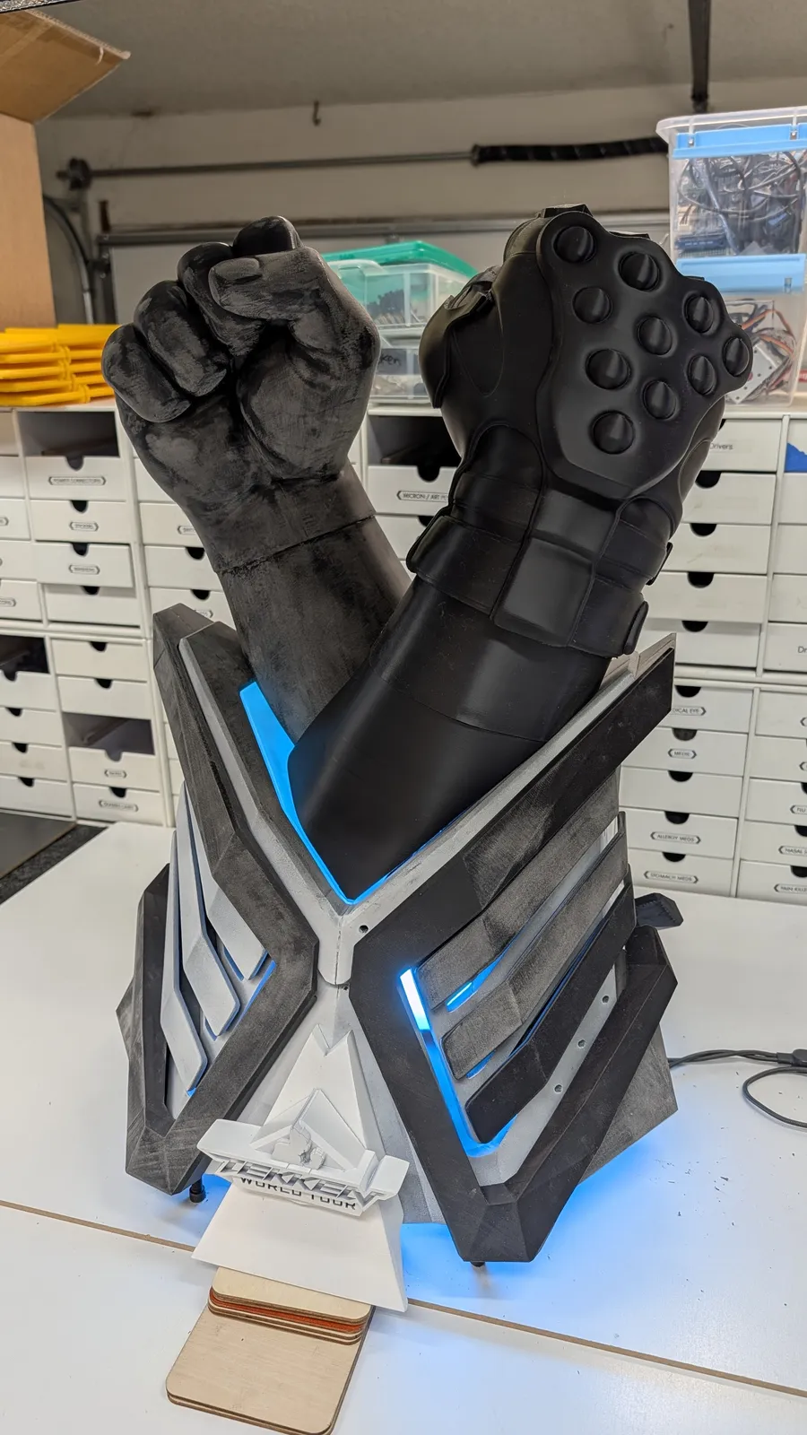 Primed crossed fists of the TEKKEN World Tour 2025 trophy by Hoku Props, knuckle and gauntlet detail
