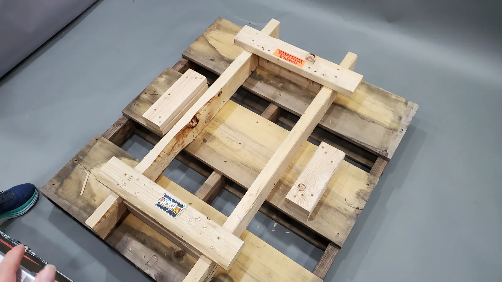 Custom wood crate frame built on a pallet for the TEKKEN World Tour 2025 trophy