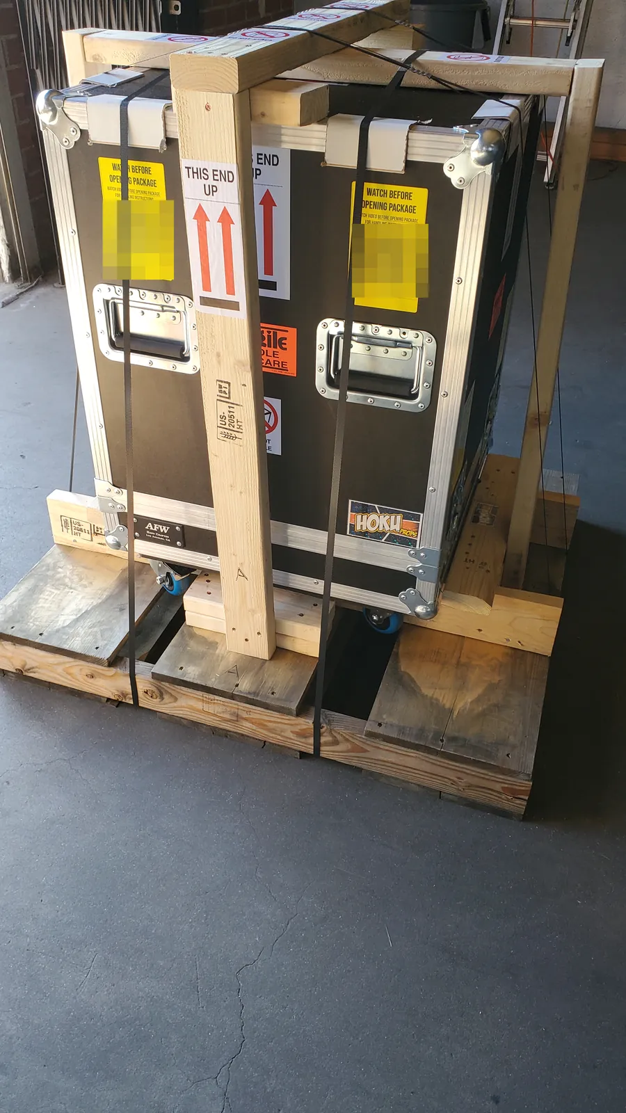 The trophy road case braced and strapped inside the wood crate on its pallet