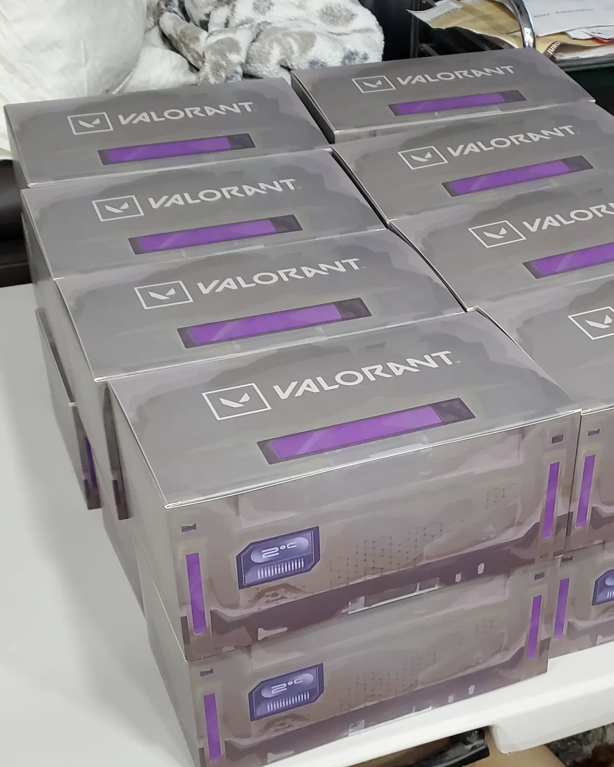 A stacked production run of VALORANT branded Radianite crates built by Hoku Props for Masters Toronto 2025, ready to ship