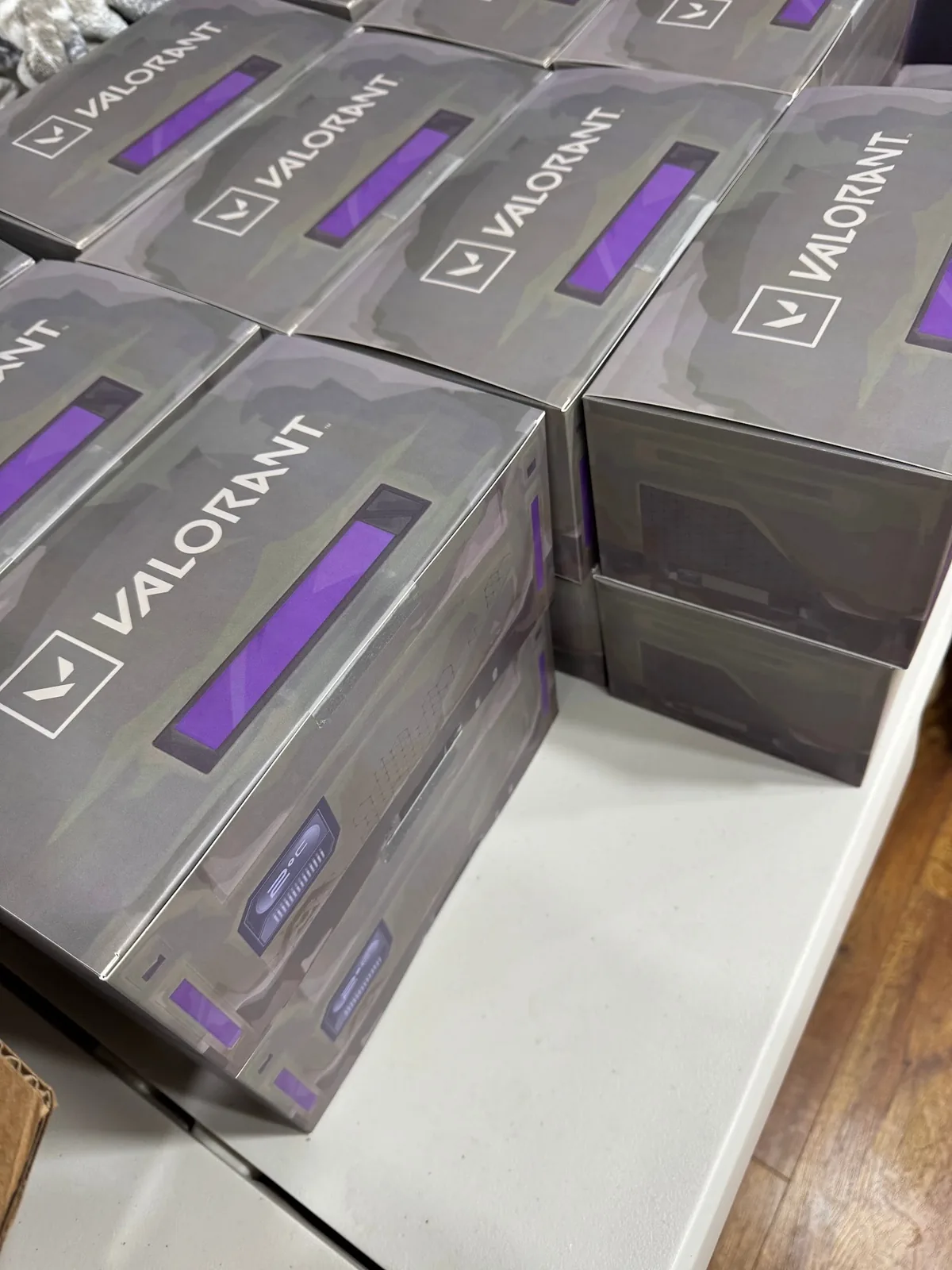 Stacked boxed Radianite units in VALORANT sleeves, ready to ship