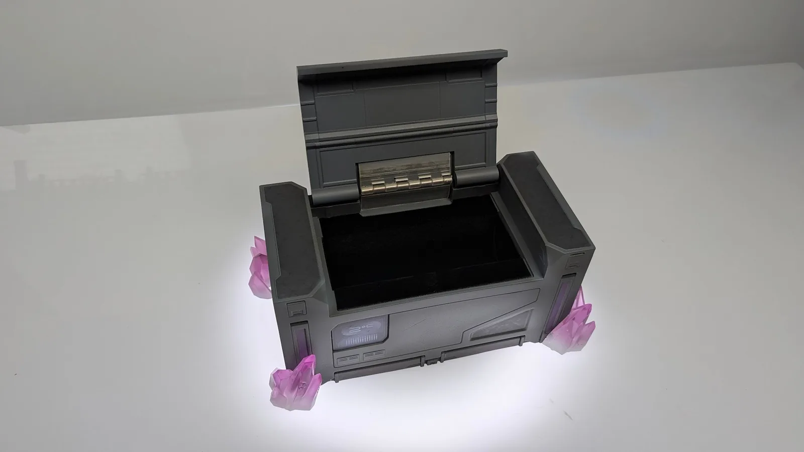 Radianite crate with the lid open, three-quarter view on a white sweep
