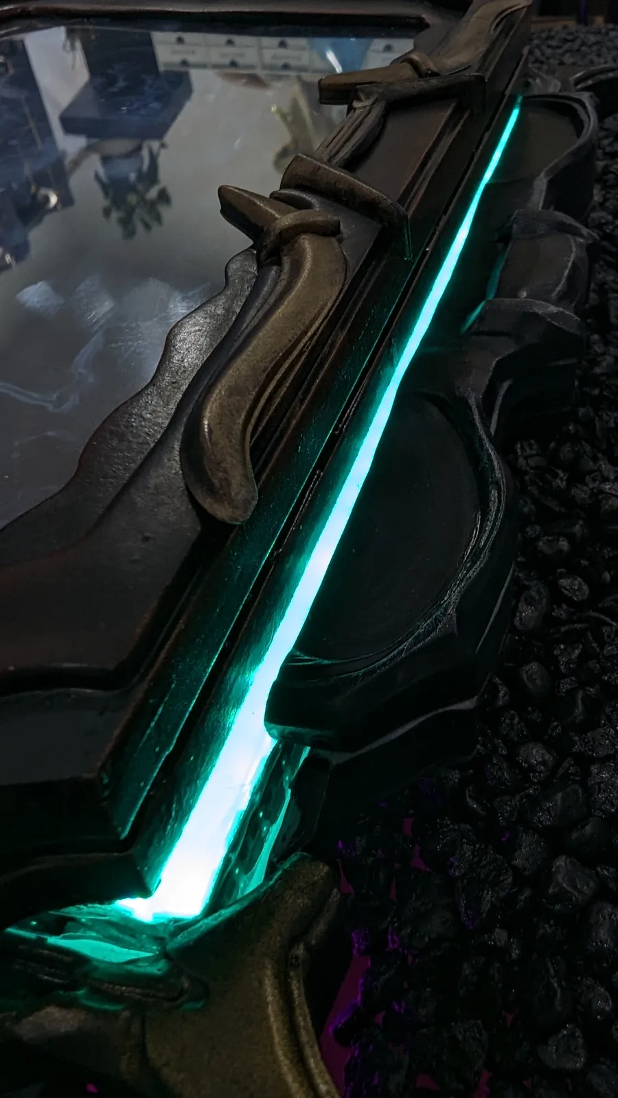 Teal light running along the spine edge of the Hoku Props Albrecht's Grimoire