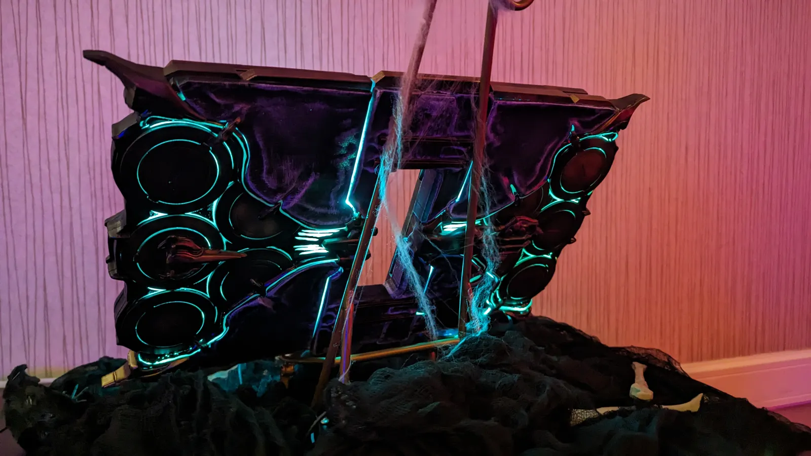 The Hoku Props Albrecht's Grimoire glowing in a dark room at TennoVIP 2023